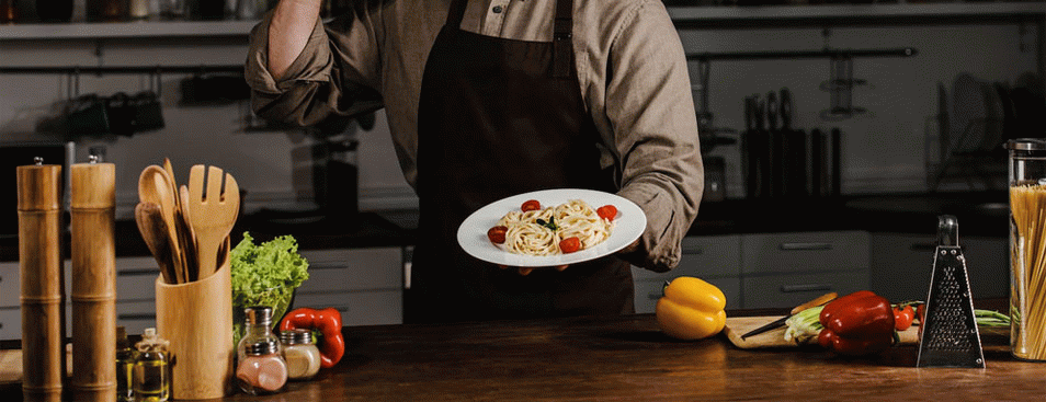 Chef Holding Plate With Pasta and Making Ok Sign